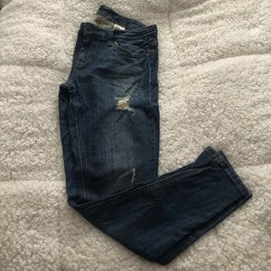 Medium wash, low-rise, lightly distressed jeans